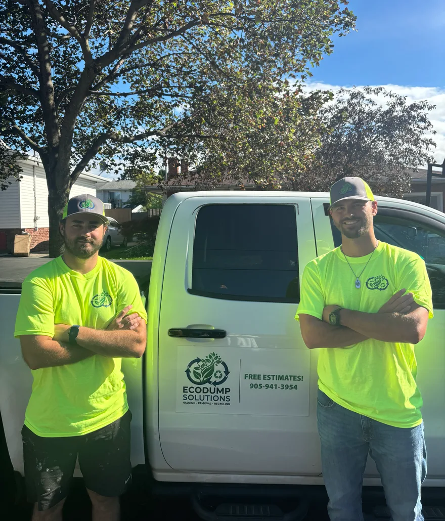 Two EcoDump Solutions crew members in front of the company truck in the Niagara Region